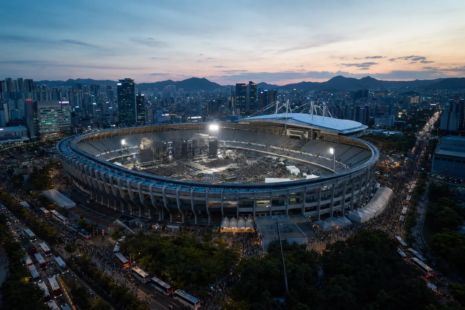 A major South Korean stadium prepared for a K-pop concert, surrounded by heavy crowds and venue pressure.