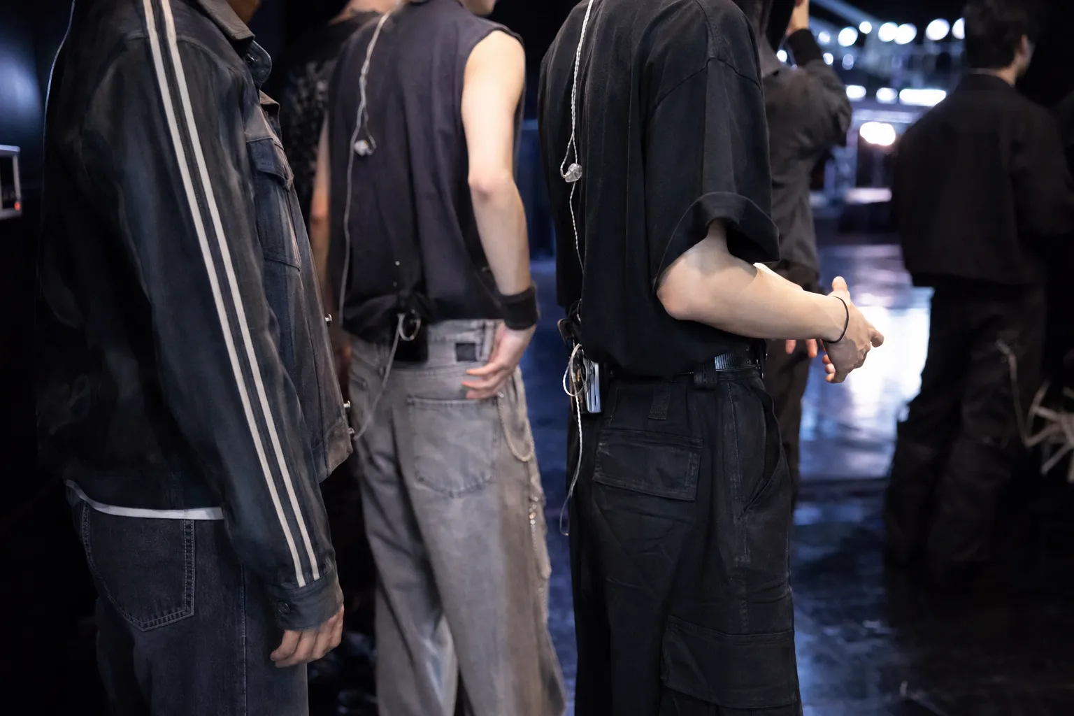 Backstage Seoul comeback showcase preparation with performers cropped to avoid identifiable faces.