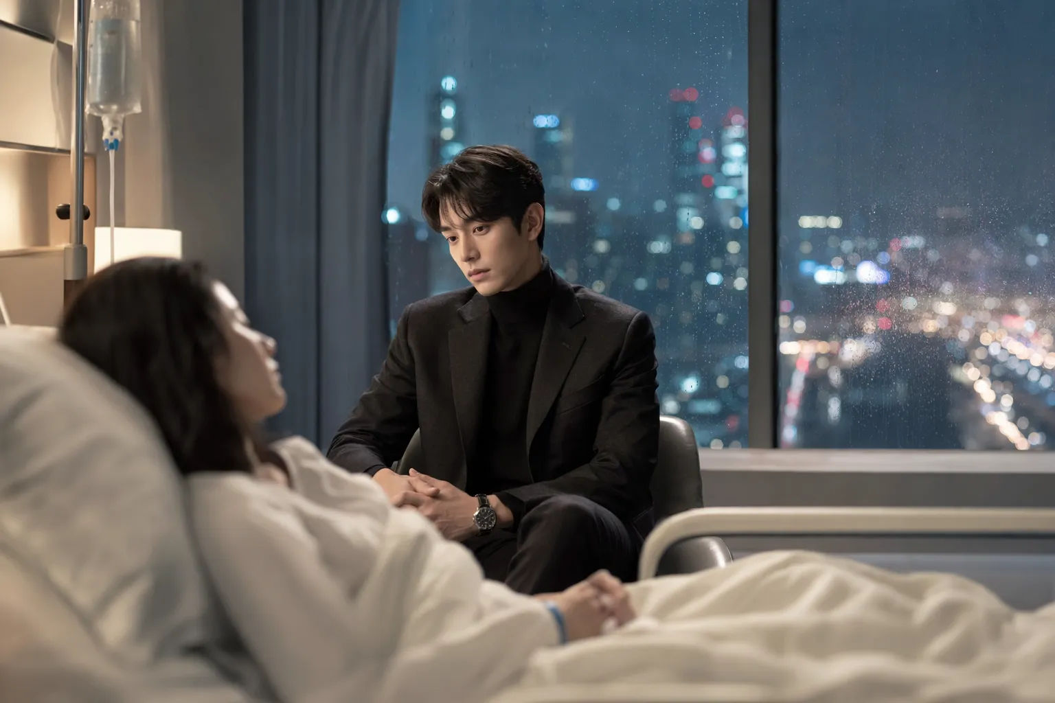 Protective hospital bedside moment with a blurred Seoul skyline and subdued K-drama atmosphere