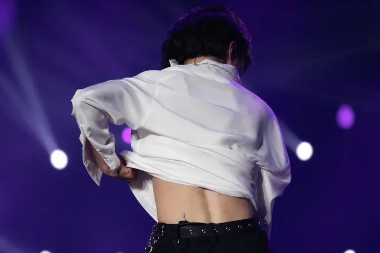 V Waist Tattoo Speculation Grows After Onstage Shirt-Lift Moment stage concept